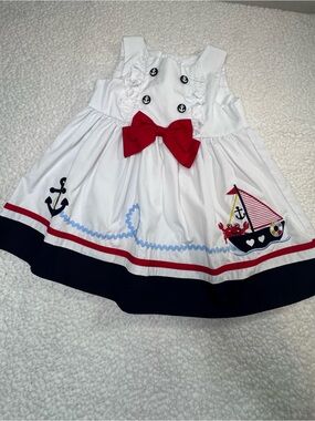 Good Lad White Baby Outfit with Pink Brand Tag and Red Accent